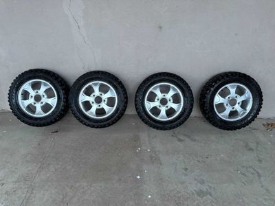 Диски r16 с МТ шинами Кордиант на Ниву.