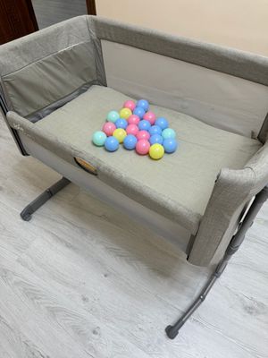Продам приставную кроватку Joie