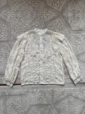 Блузка за 50000 сум.