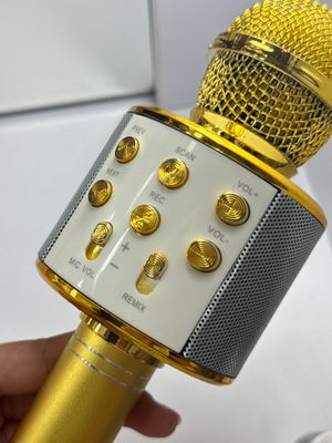 Микрофон со встроенной колонкой золотого цвета