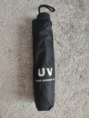 Зонт от дождя и UV лучей.