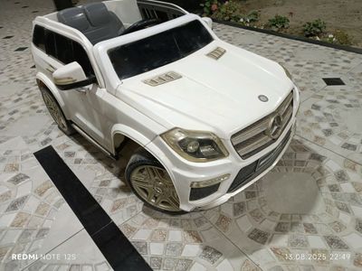 детская машинка в бонус качели
