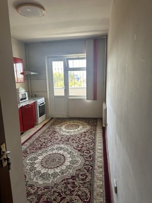 М. Новза. 9 этажный панельный дом.