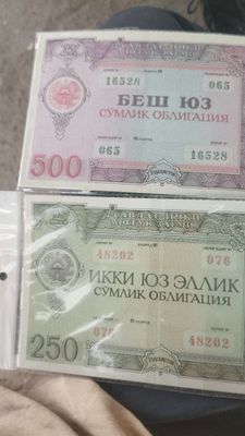 Бумажные деньги и облигации одна пачка 500000 сум пономерам