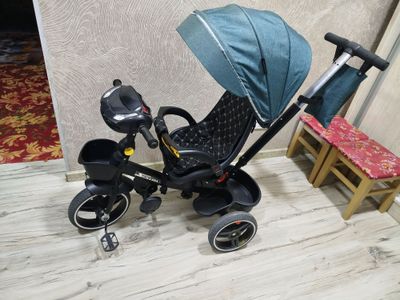 Bolalar kalyaskasi va velosipedi