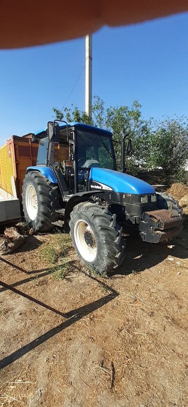 2005 yil NEW HOLLOND TL 100 tractor sotiladi 2005 yil NEW HOLLOND TL 100 tractor sotiladi