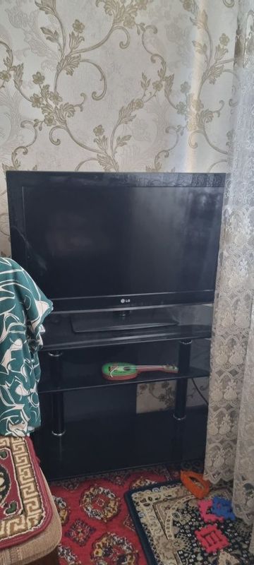 Телевизор подставка билан